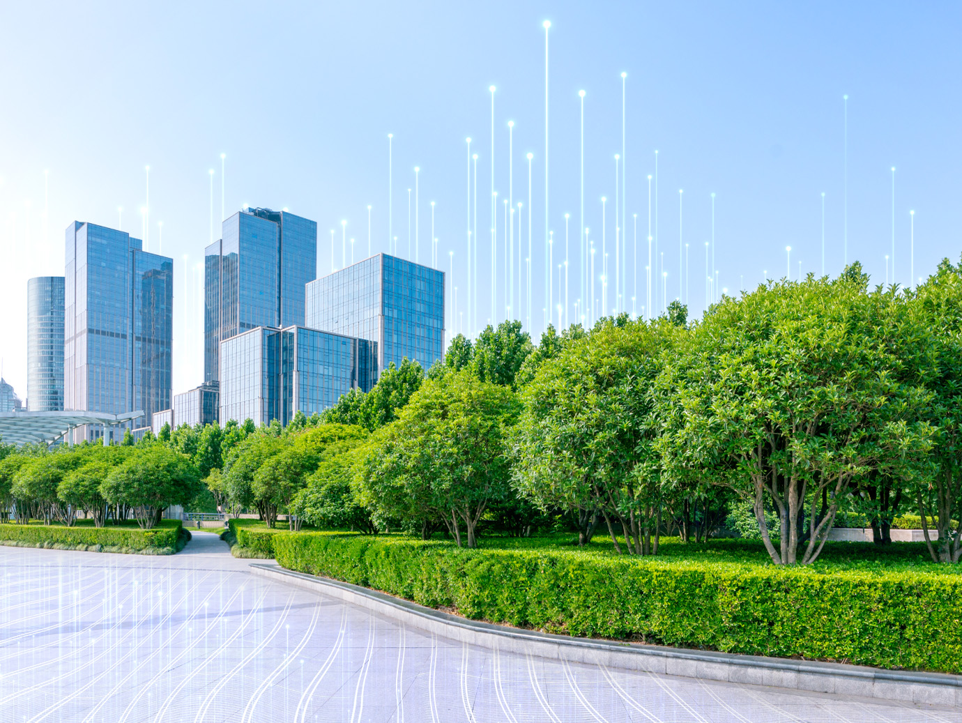 Commercial buidlings at the backdrop of trees in a garden with an overlay of Openblue graphics
