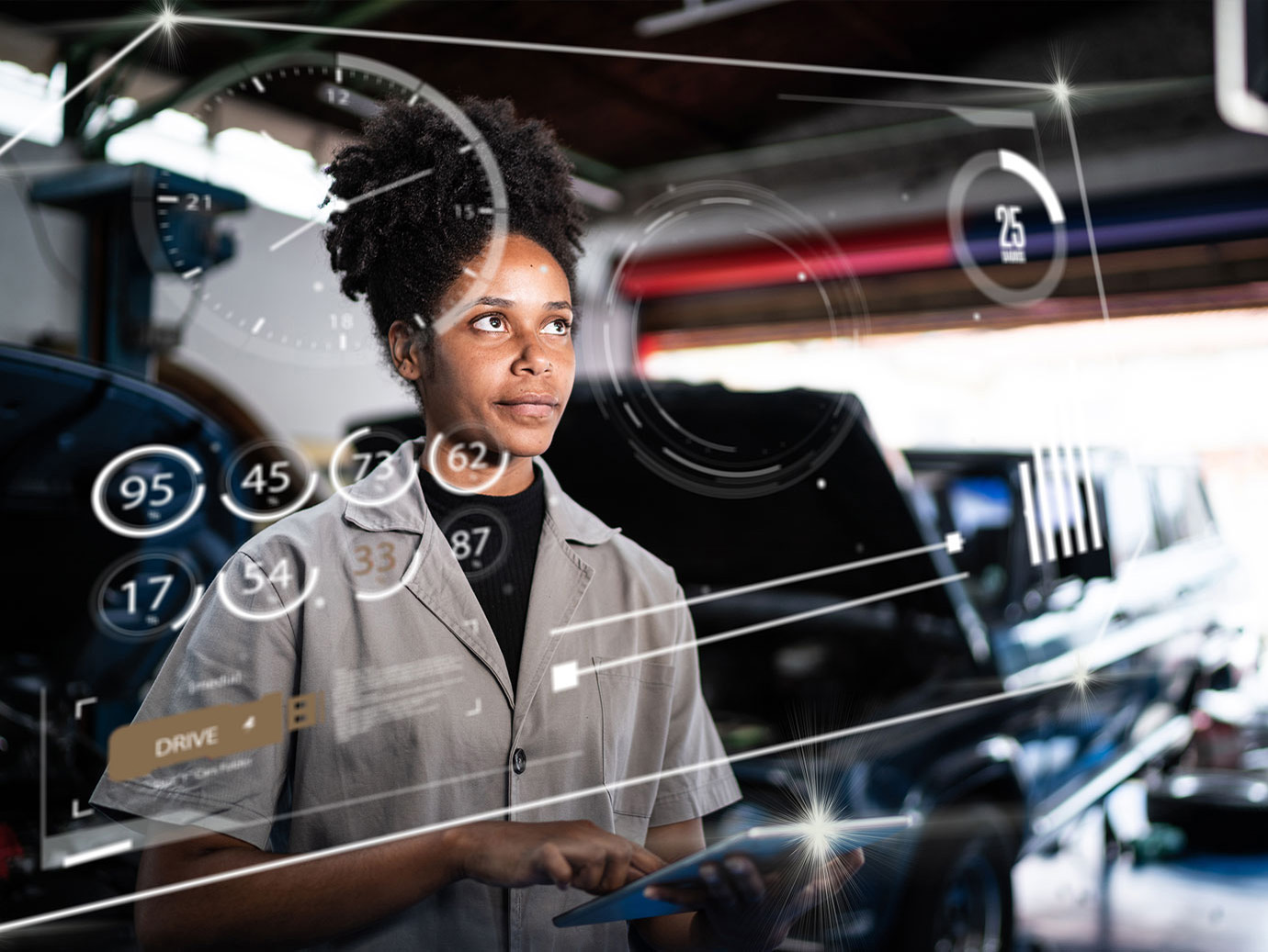 A woman holding a tablet while looking at holographs of a car's settings