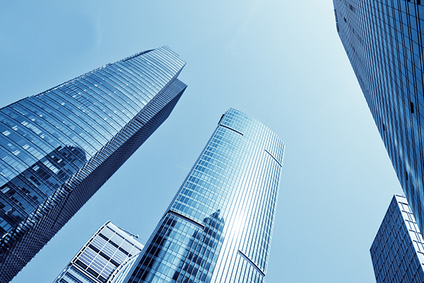 High-rise commercial buildings under the blue sky