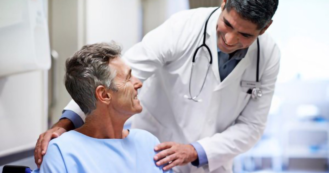 Doctor reassuring an elderly patient