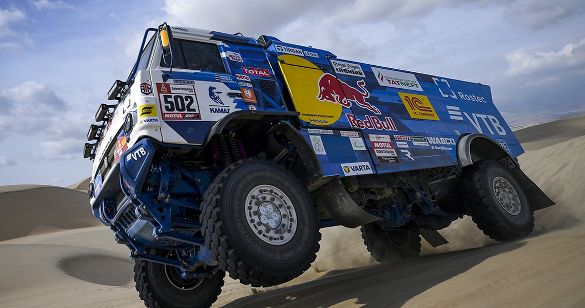 A KAMAZ-master truck travelling on a desert