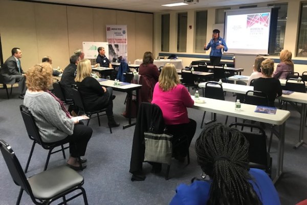 Women seated at a seminar hosted by Johnson Controls and Lincoln Tech