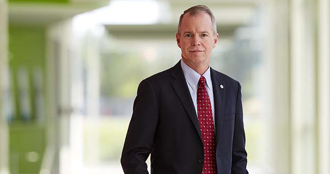 George Oliver, Chairman & CEO, Johnson Controls smiling at the camera