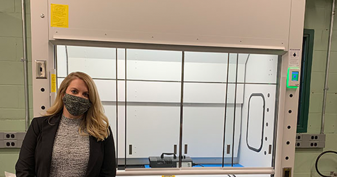 Johnson Controls' Beth Mankameyer poses in front of one of the new fume hoods at Purdue University's Ray W. Herrick Laboratories.