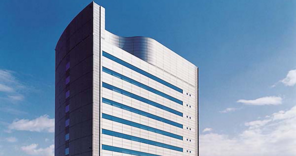 Modern high-rise tower against the blue sky