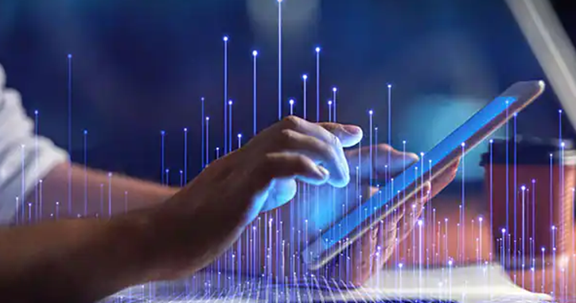 Close-up of a man scrolling on a screen tablet, overlaid with OpenBlue graphics 