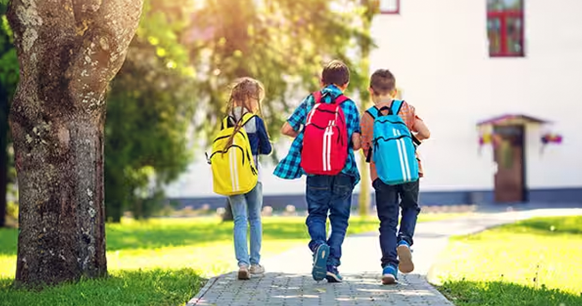 three-school-children-walking