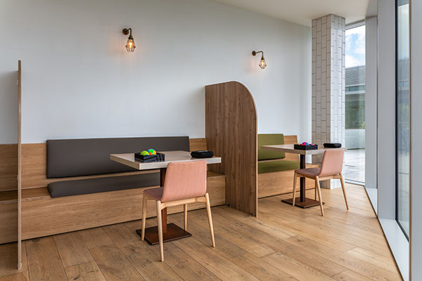 Pictured is a dedicated eating zone for private dining. “Communal eating in a large open space can be a difficulty for many. For some, lunch break symbolizes a time to reset, regulate and take some time out. Creating the opportunity to have more private designated eating and lunch spaces separate to the open plan canteen was an important point highlighted by the Occupational Therapist. The smells and noise of an open plan office canteen can mean sensory overload for some, so we wanted to offer more choice and provide simple adaptations within this environment,” said Evans.