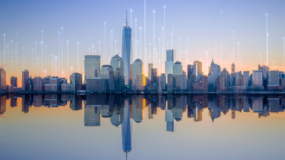 Cityscape overlaid with graphics depicting transmission nodes